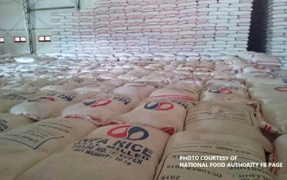 <p>Sacks of rice kept at a National Food Authority warehouse. <em>(PNA file photo)</em></p>